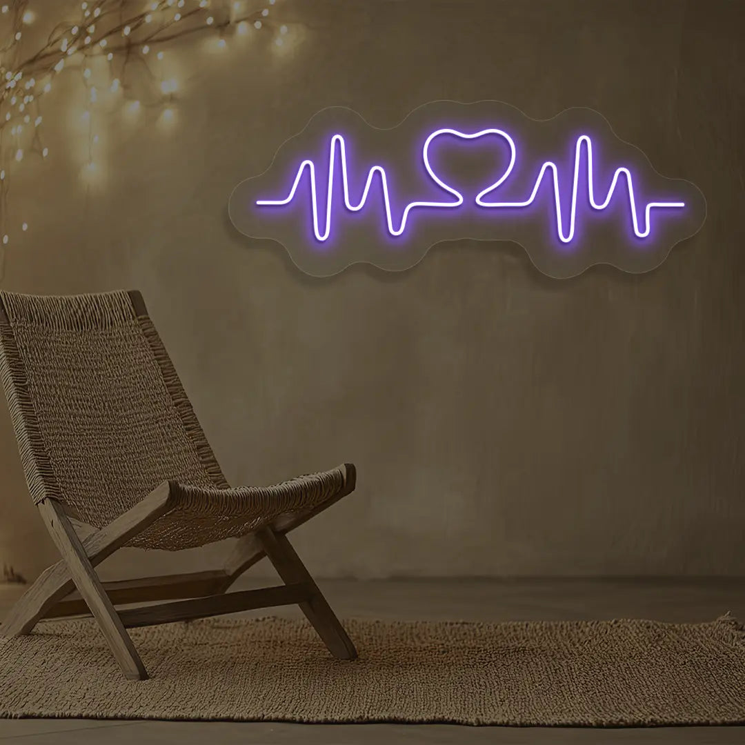 purple love pulse neon sign mounted on a wall