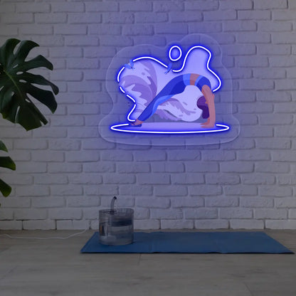 Urdhva Dhanurasana Yoga Neon Artwork lighting up in blue color in a yoga room