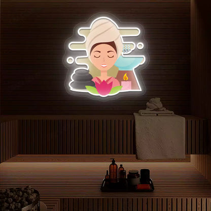 Steam Wellness Neon Artwork lighting up in white color on a wooden spa wall