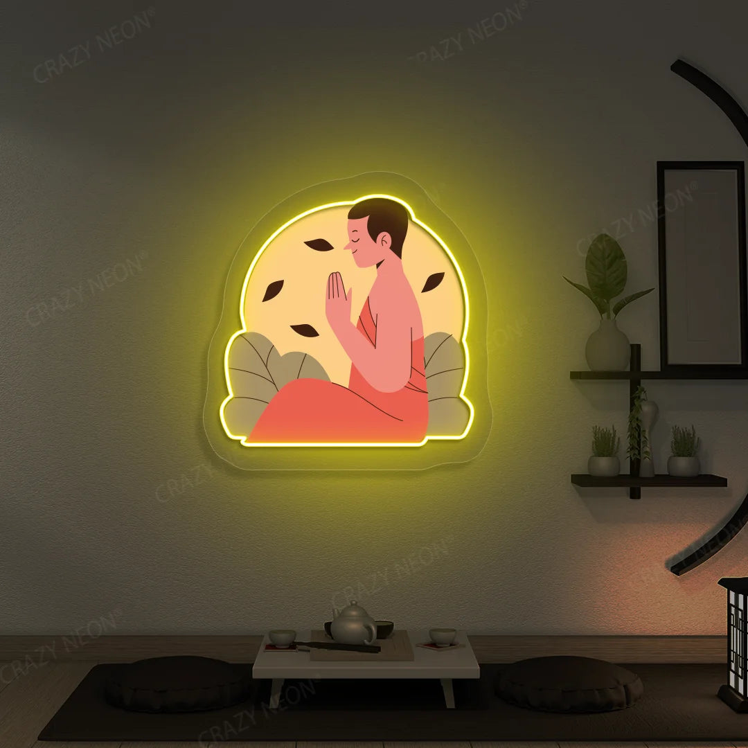 Serene Monk Neon Artwork lighting up in yellow color in a yoga room 