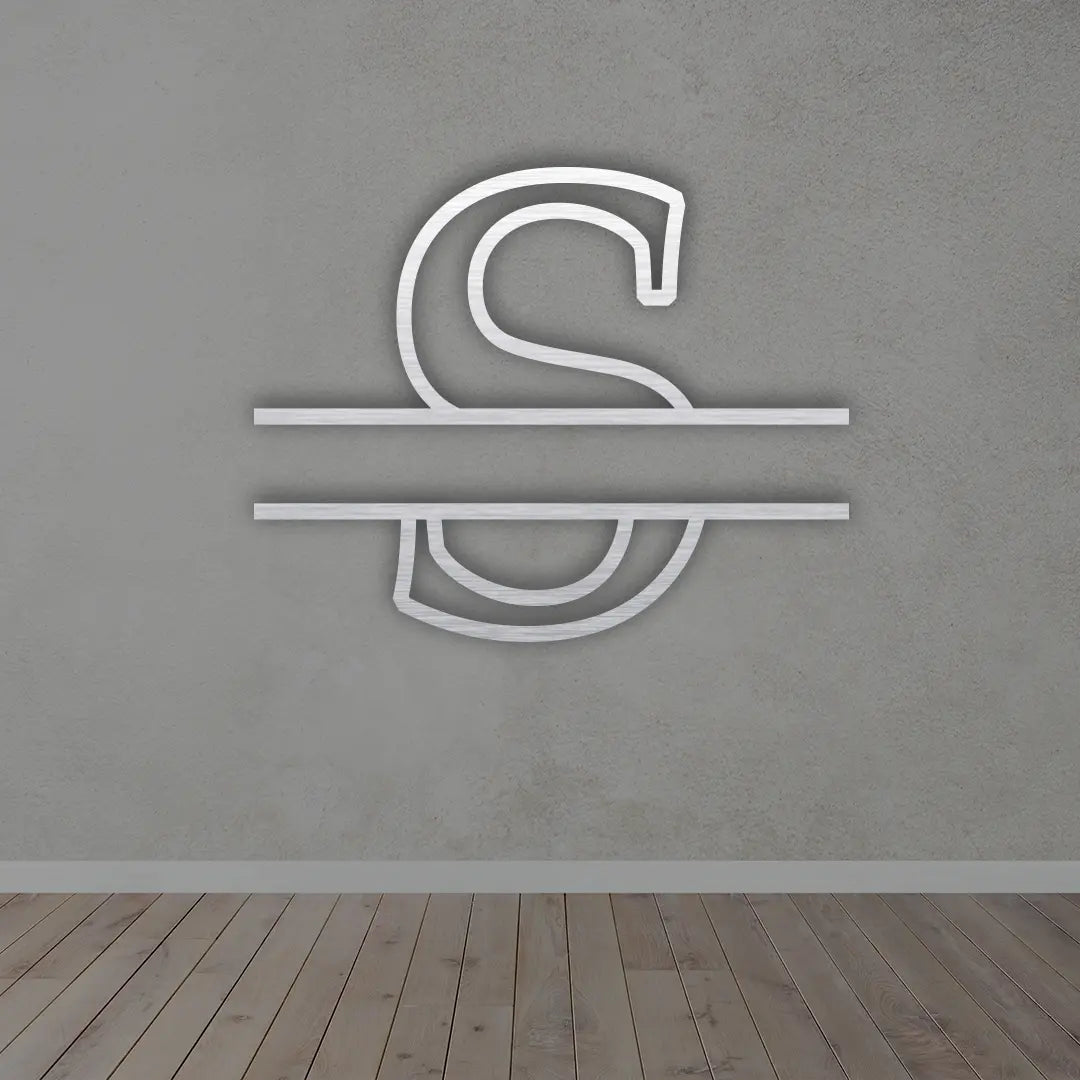 Split Letter Metal Monogram sign in silver colour mounted on a wall