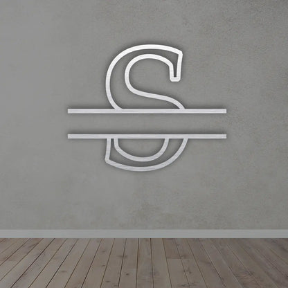 Split Letter Metal Monogram sign in silver colour mounted on a wall