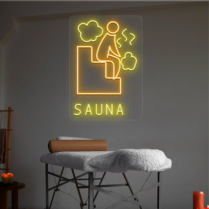 Sauna Relax neon sign in orange and yellow colors glowing in a spa room