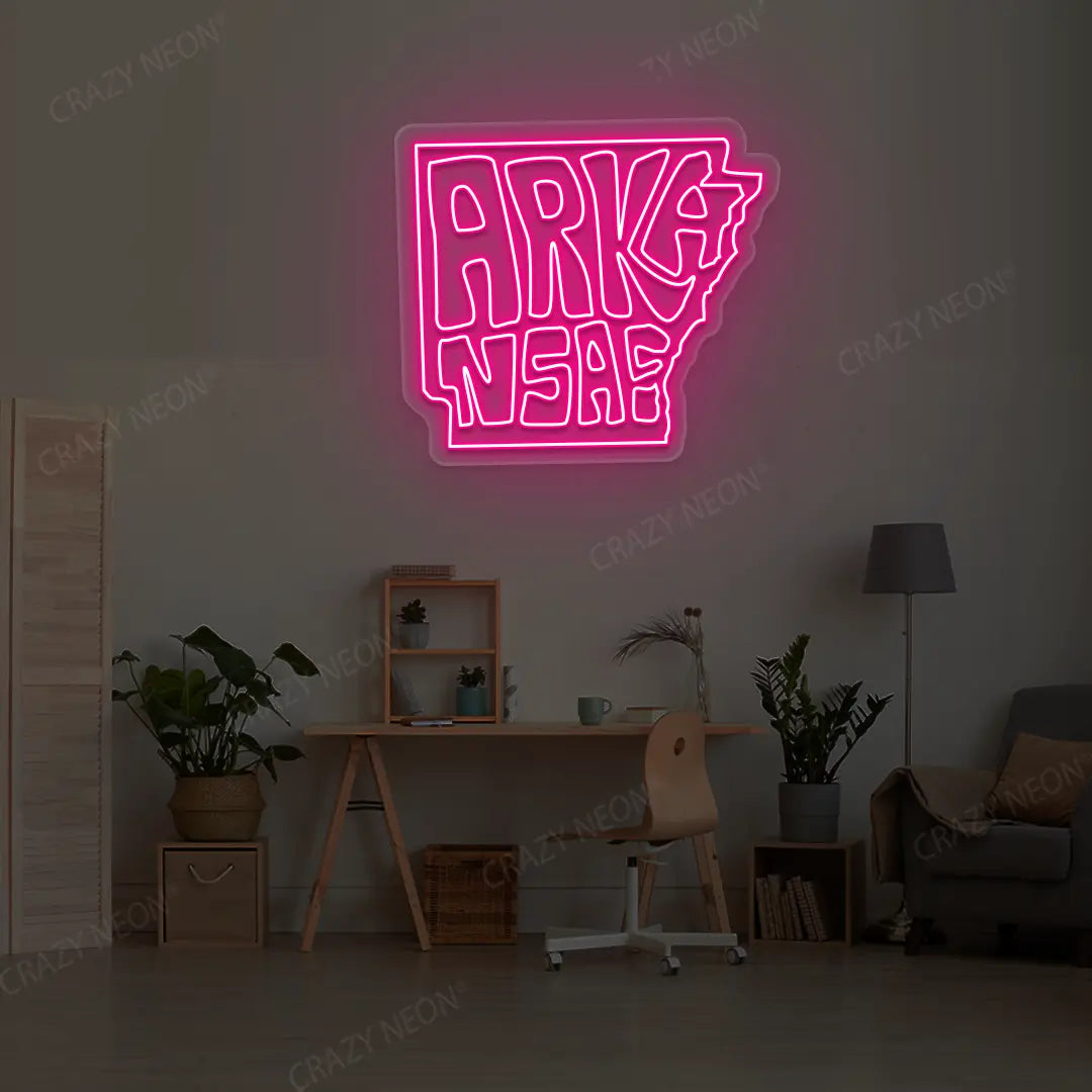 ARKANSAS Map Neon Sign lighting up in pink color in a room