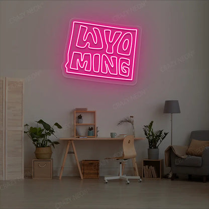 WYOMING Map Neon Sign lighting up in pink color in a room