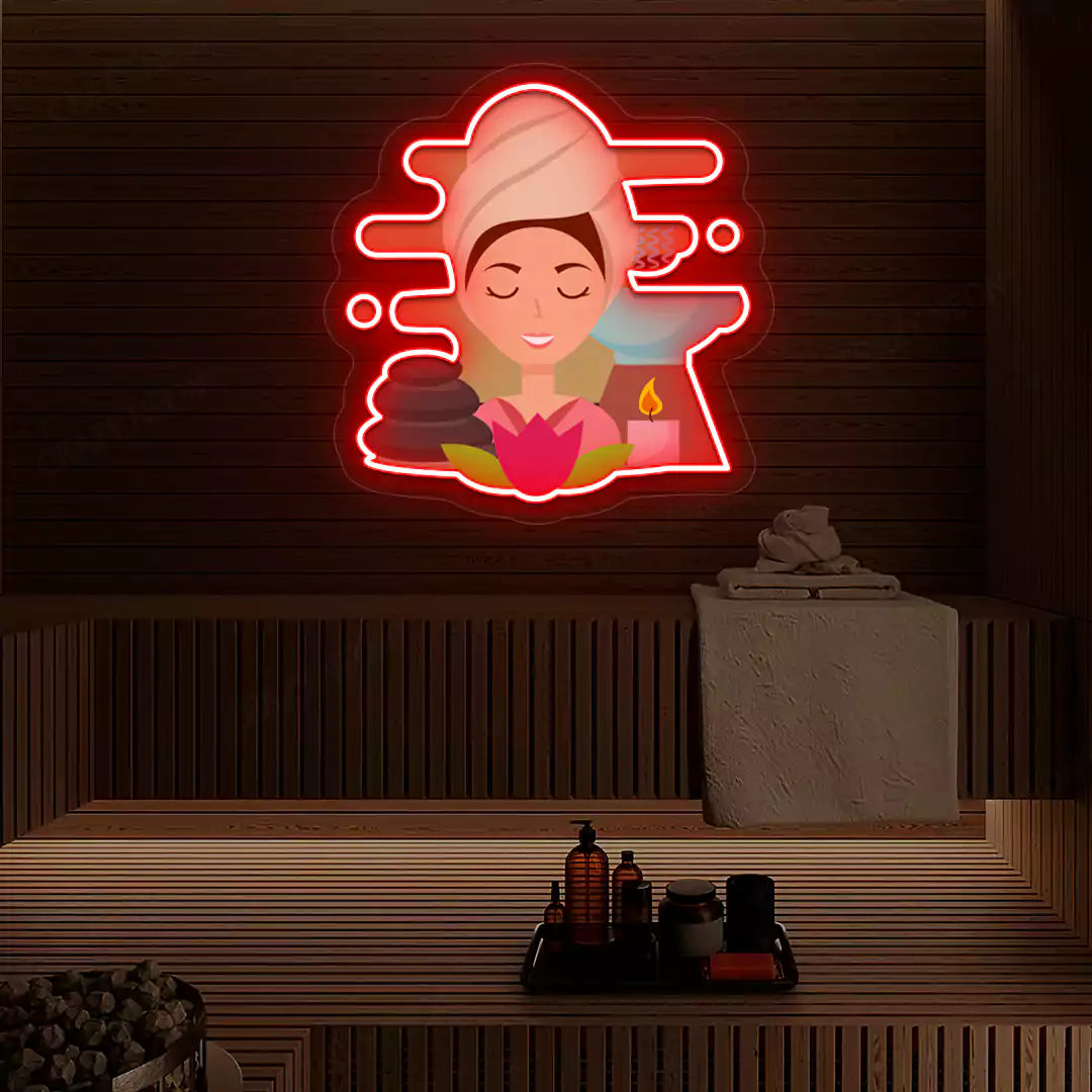 Steam Wellness Neon Artwork lighting up in red color on a wooden spa wall