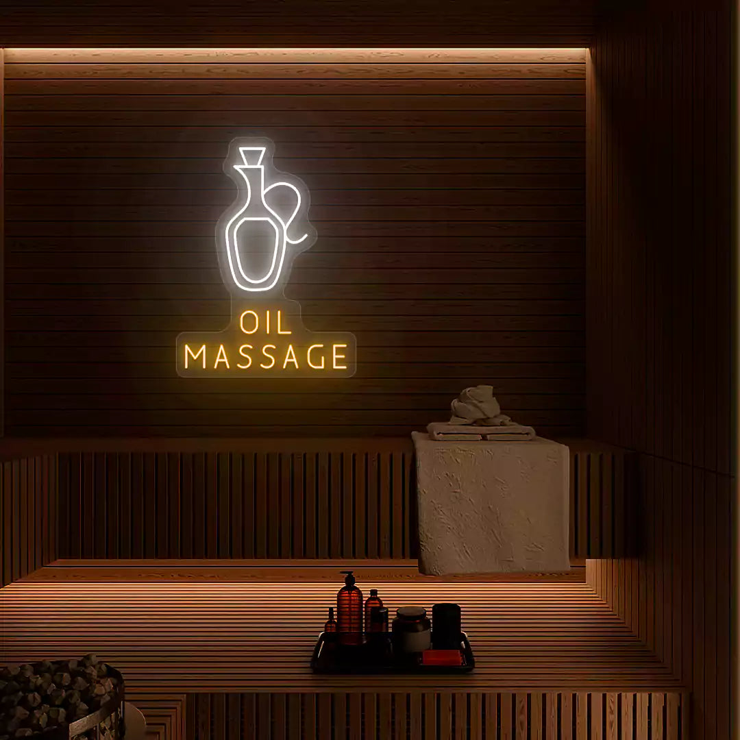 Oil Massage neon sign in white and orange colors glowing on a wooden wall
