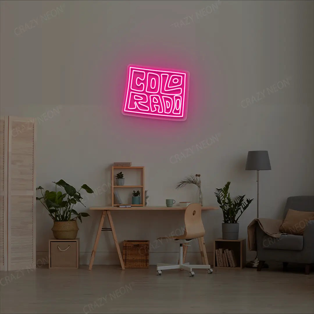 COLORADO Map Neon Sign lighting up in pink color in a room