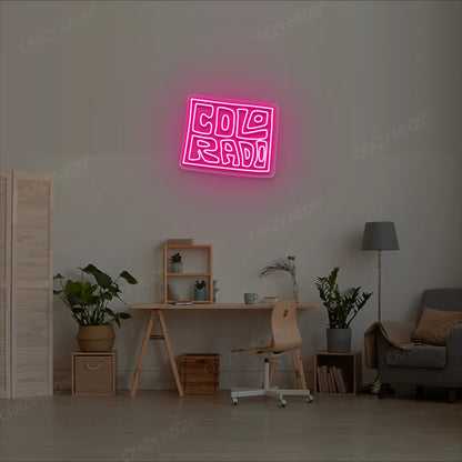 COLORADO Map Neon Sign lighting up in pink color in a room