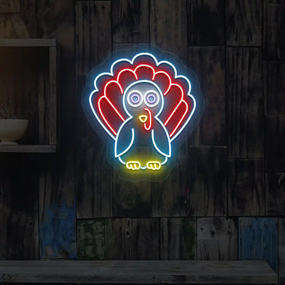Vibrant thanksgiving turkey neon sign in ice blue and red.