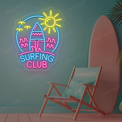 ice blue pink and yellow surfing club beach neon sign mounted on a wall