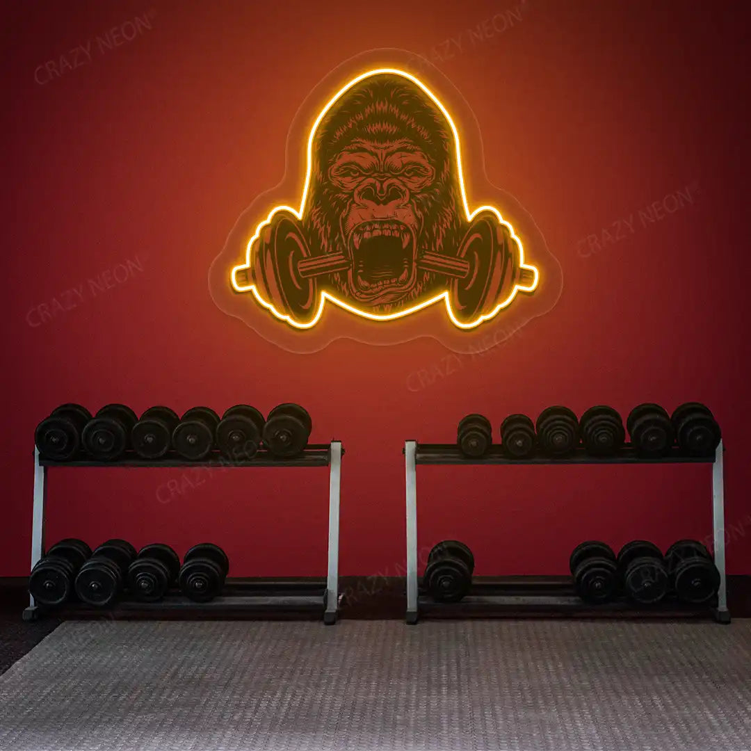 orange gorilla barbell gym neon artwork mounted on a wall