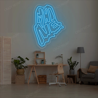 MAINE Map Neon Sign lighting up in iceblue color in a room