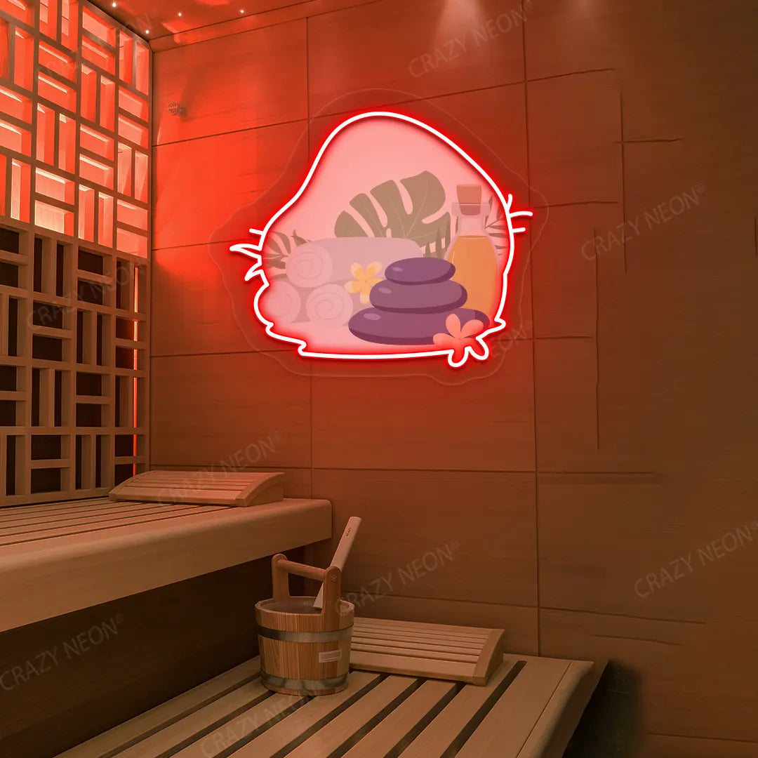 Spa Stones & Serenity Neon Artwork lighting up in red color on a wooden wall