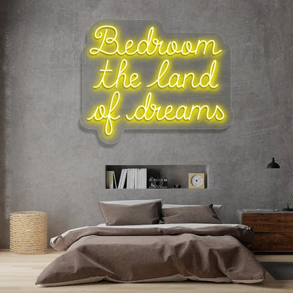 yellow bedroom the land of dreams neon sign mounted on a wall
