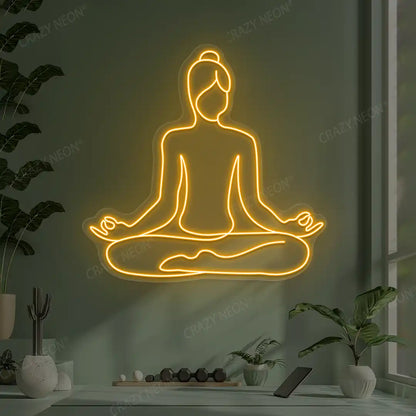 Swastikasana Contour Yoga Neon Sign lighting up in orange color in a yoga room