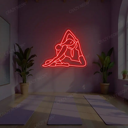 Eka Pada Rajakapotasana Yoga Neon Sign lighting up in red color in a yoga room