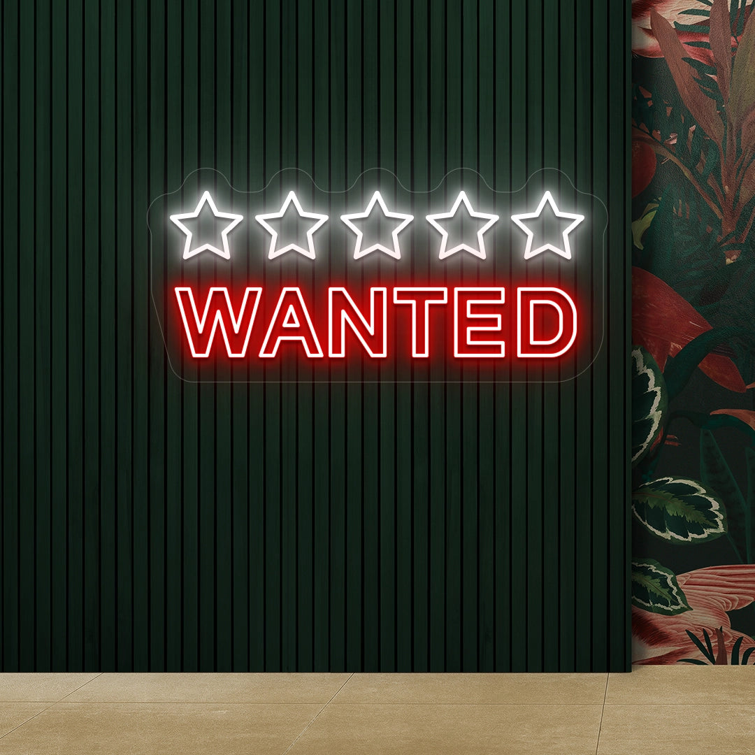 red and white five star wanted vintage neon sign mounted on a wall