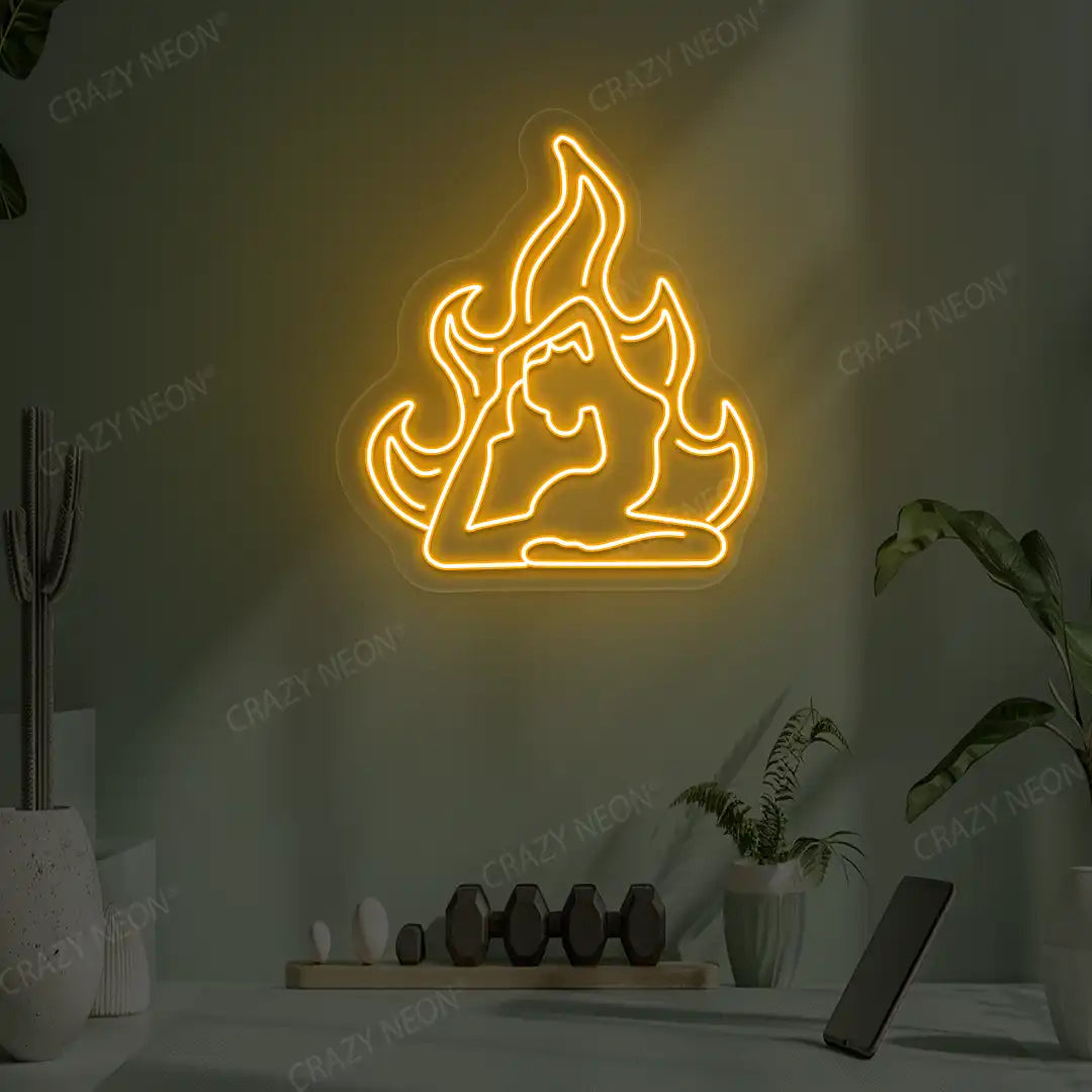 Flamed Eka Pada Rajakapotasana Yoga Neon Sign lighting up in orange color in a yoga room