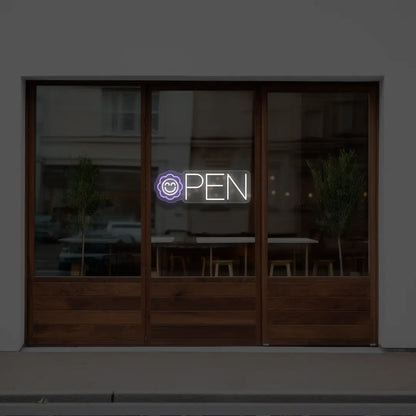 purple flower open neon sign hanging on a window
