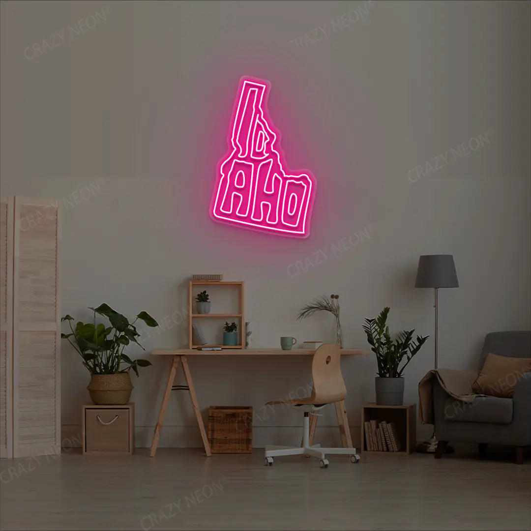 IDAHO Map Neon Sign lighting up in pink color in a room