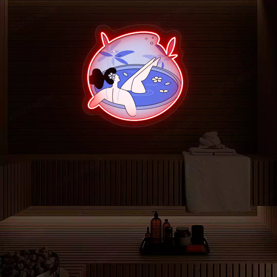 Blue Blossom Bath Neon Artwork lighting up in red color on a wooden spa wall