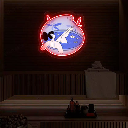 Blue Blossom Bath Neon Artwork lighting up in red color on a wooden spa wall