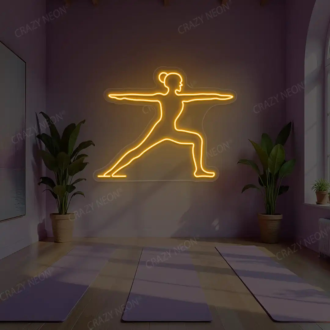 Virabhadrasana II Yoga Neon Sign lighting up in orange color in a yoga room