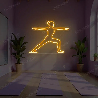Virabhadrasana II Yoga Neon Sign lighting up in orange color in a yoga room