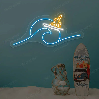orange white and ice blue surfer riding wave neon sign mounted on a wall