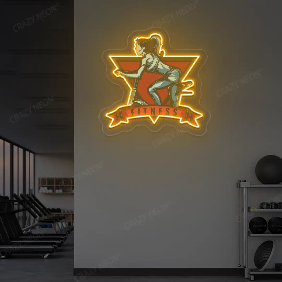 orange girl spinning fitness neon artwork mounted on a wall