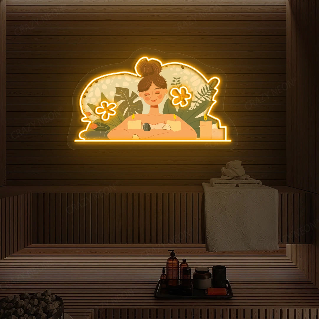 Aromatherapy Relaxation Neon Artwork lighting up in orange color on a wooden spa wall