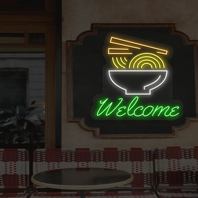 green white yellow and orange welcome noodle bowl neon sign mounted on a wall