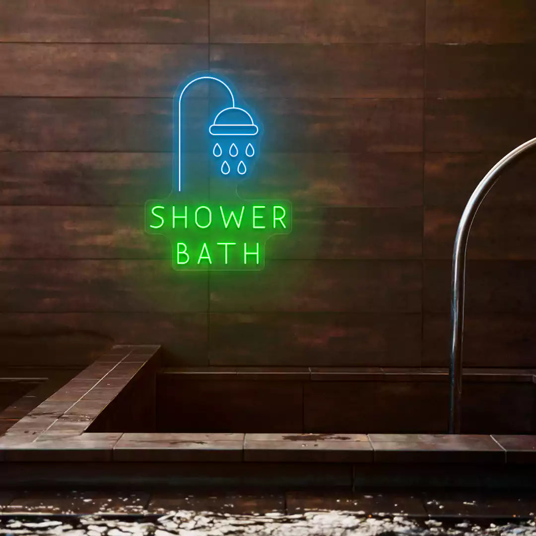 Shower Bath neon sign in ice blue and green colors glowing on a wooden wall