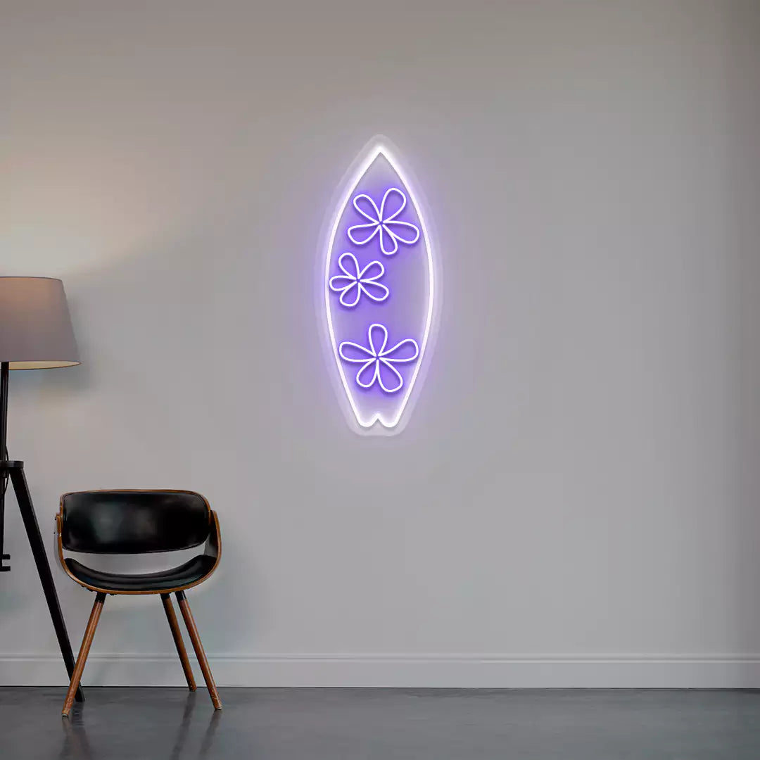 purple and white floral surfboard neon sign mounted on a wall