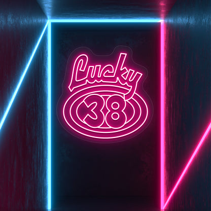 pink the lucky 38 vintage neon sign mounted on a wall