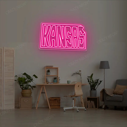 KANSAS Map Neon Sign lighting up in pink color in a room