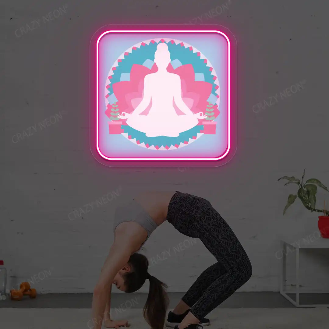Padmasana Mandala Yoga Neon Artwork lighting up in pink color in a yoga room