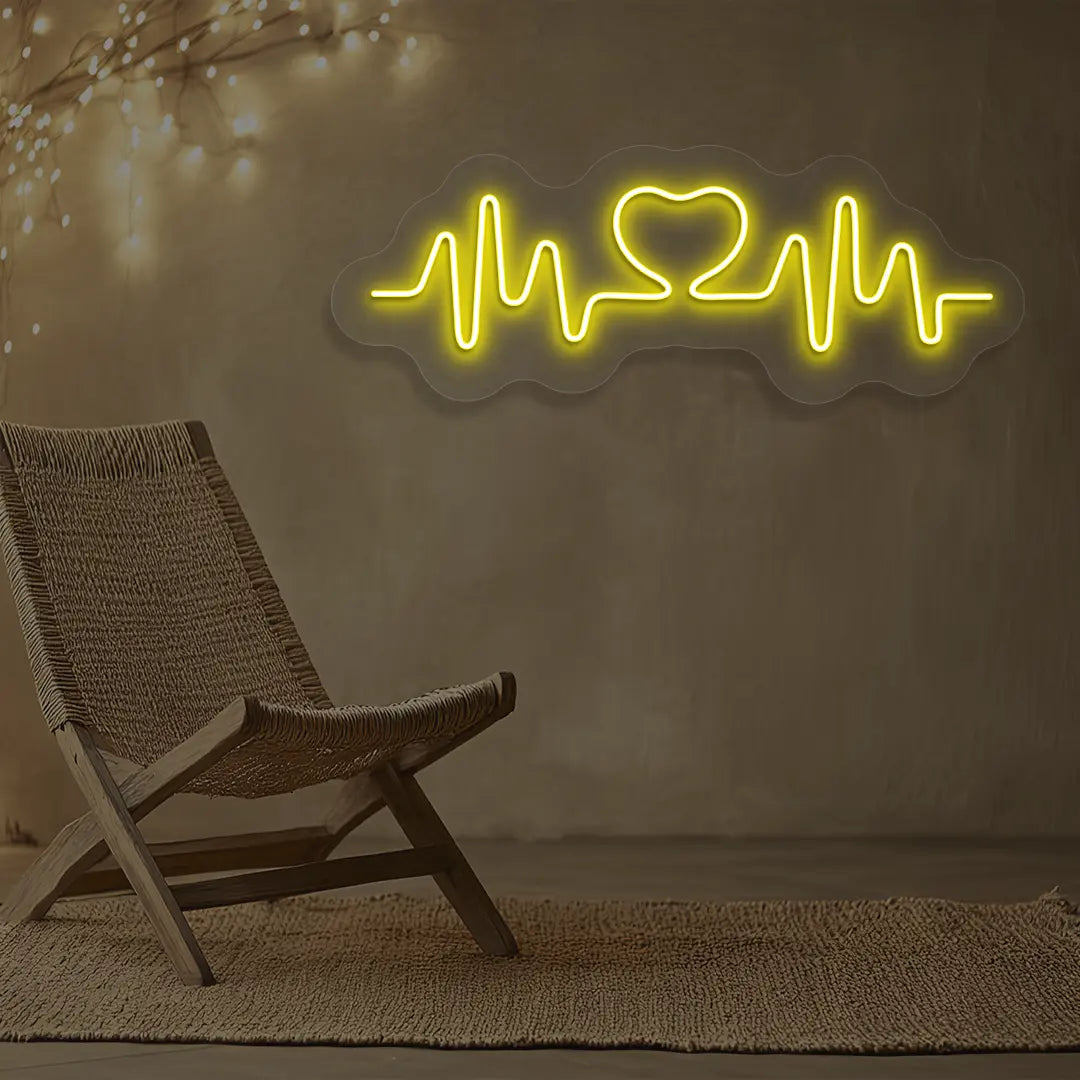 yellow love pulse neon sign mounted on a wall