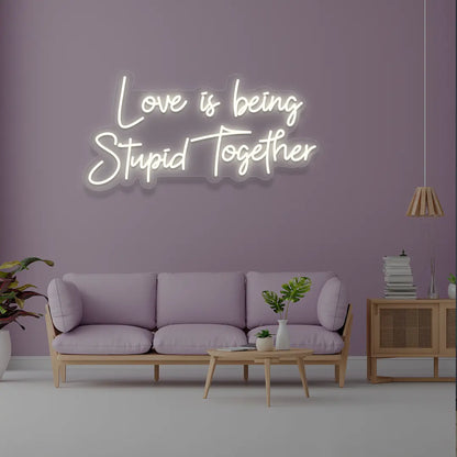 Love Is Being Stupid Together Neon Sign in White Color 