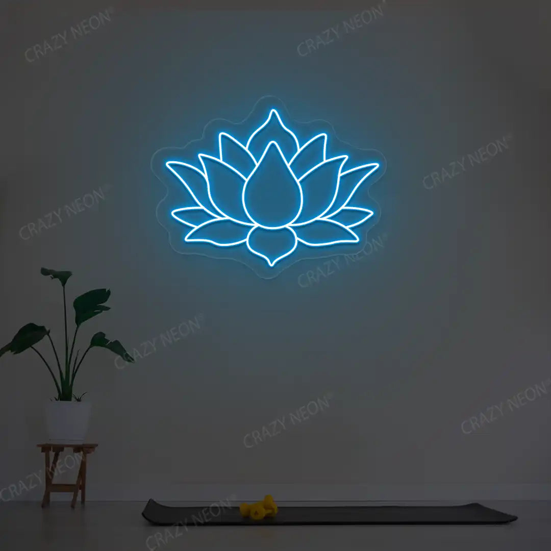Lotus Flower Neon Sign lighting up in ice blue color in a yoga room