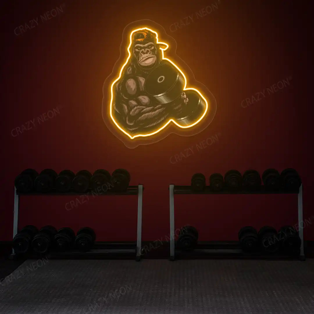orange gorilla dumbbell lifting gym neon artwork mounted on a wall