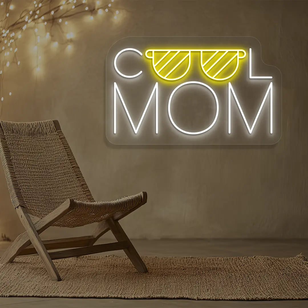 yellow and white cool mom trendsetter neon sign mounted on a wall