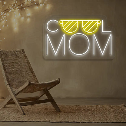 yellow and white cool mom trendsetter neon sign mounted on a wall
