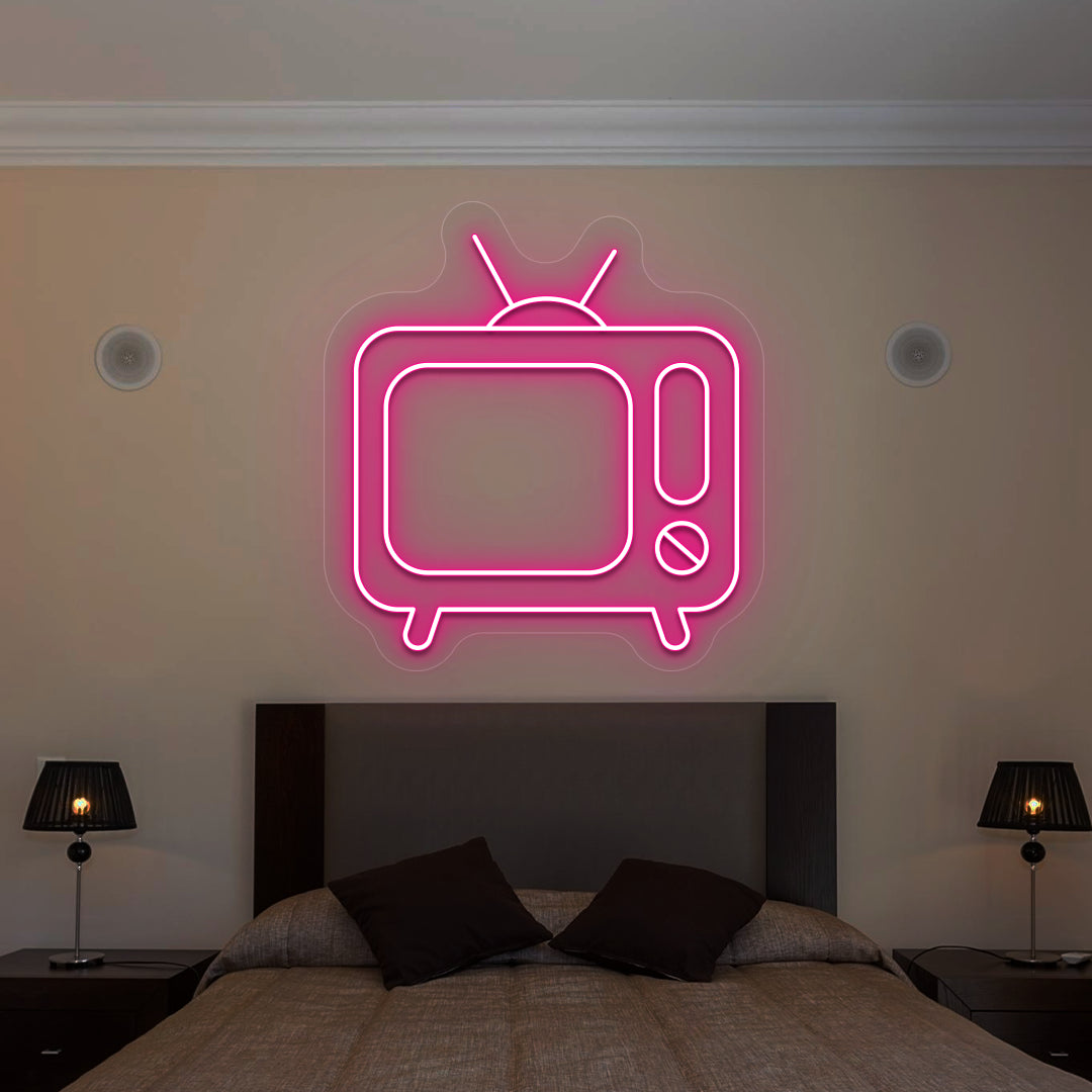 pink retro tv vintage neon sign mounted on a wall