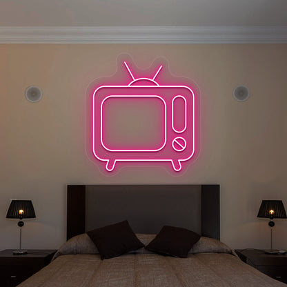 pink retro tv vintage neon sign mounted on a wall