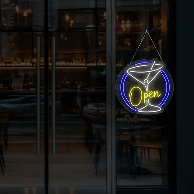 yellow cocktail open neon sign hanging on a window