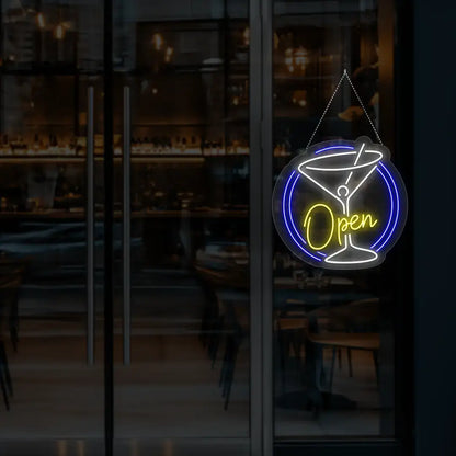 yellow cocktail open neon sign hanging on a window