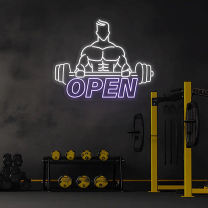 purple and white open gym bodybuilder neon sign mounted on a wall