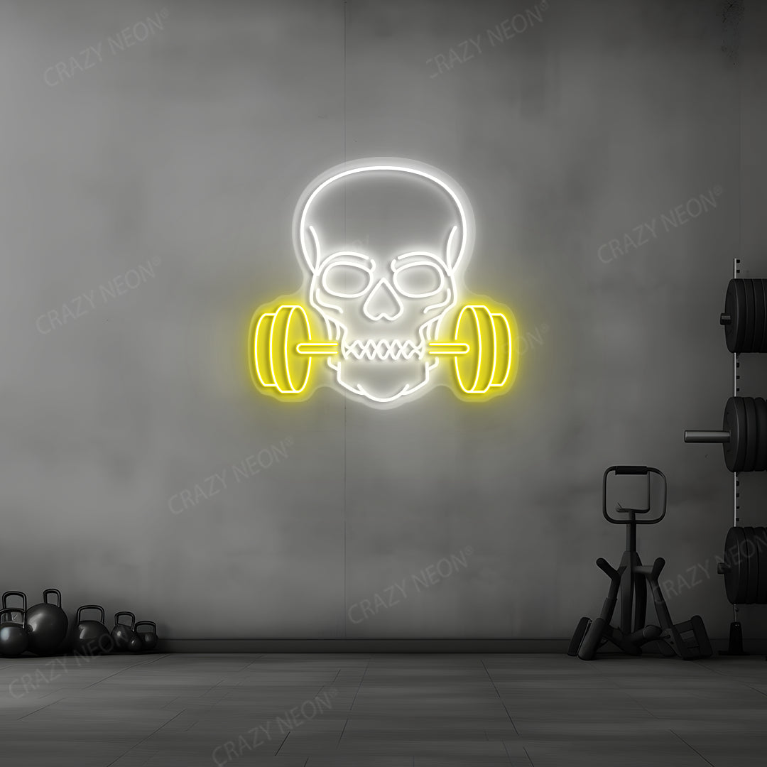 yellow and white skull barbell gym neon sign mounted on a wall